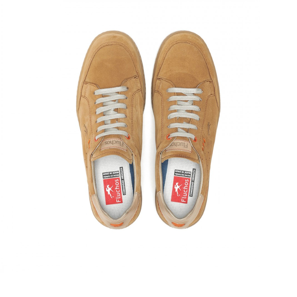 A pair of FLUCHOS Mens Leo F1722 Brown suede shoes with white laces, viewed from above. Insoles display the FLUCHOS logo in red and white; shoes feature stitched details and toe perforations for comfort.