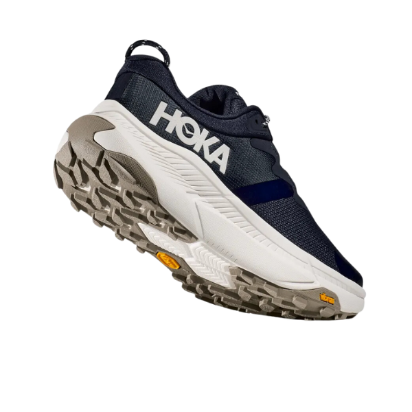A single HOKA Mens Transport Wide Navy athletic shoe is shown against a white background, angled to display the sole and side logo, featuring a rugged VIBRAM outsole and textured tread.