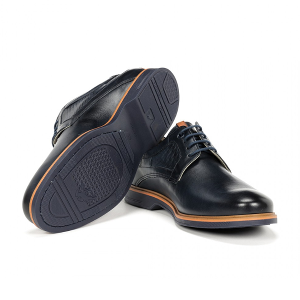 The FLUCHOS Mens Tristan F1744 Blue shoes feature blue leather with brown accents, textured panels, blue laces, and rubber soles, offering stylish design and all-day comfort with flexibility to help relieve foot pain.