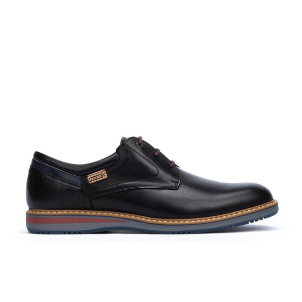 The Pikolinos Mens Avila Black by PIKOLINOS is a black leather dress shoe with brown accents, lace-up design, light blue rubber sole, detailed stitching, and a side tag—providing stylish comfort and foot pain relief.