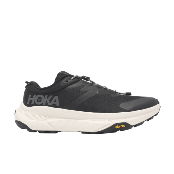 The HOKA Mens Transport Wide in Black/White features a modern design, black detailing, a thick white sole, and durable VIBRAM outsole for superior traction and performance. The signature HOKA logo adds a bold touch.