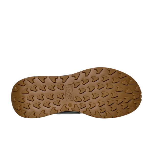 The Teva Mens Ellwood Dark Grey shoe features a brown rubber sole made from recycled materials, with a textured triangular tread and the Teva logo embossed in the center, shown on a white background.