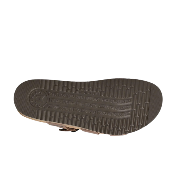 The image displays the sole of the Mephisto Womens Hannel Sandals in dark brown by MEPHISTO, featuring a unique tread design, an embossed logo by the heel, and a leather-lined cork footbed for superior comfort.