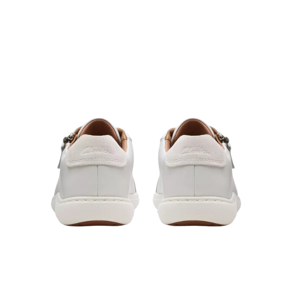 The CLARKS Womens Nalle Lace White sneakers feature white leather, Contour Cushion footbed for pain relief, white soles, light brown lining, and subtle branding on the heel tabs—all viewed from the back.