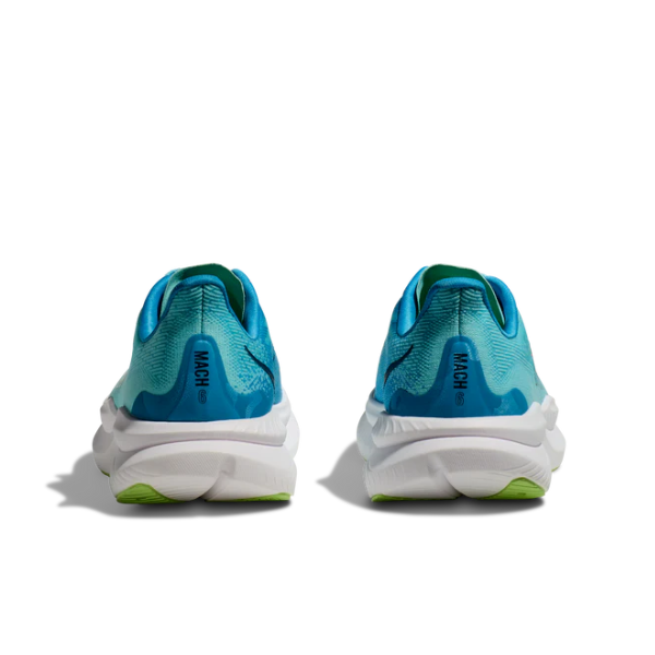 The HOKA Womens Mach 6 (Medium Width) Teal running shoes are shown from the back, featuring white soles, green accents, and MACH printed on the heel—designed by HOKA for everyday comfort and support.