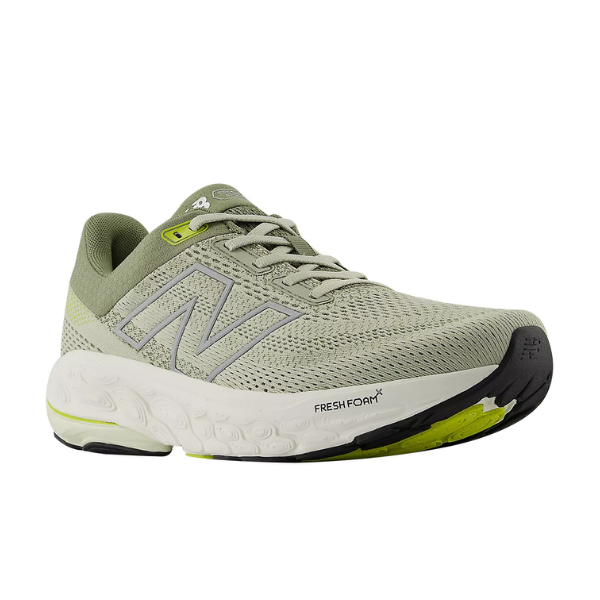 The New Balance Mens Fresh Foam 860v14 Green features a light gray mesh upper, signature N logo, cushioned white Fresh Foam sole, and black with neon yellow outsole accents.