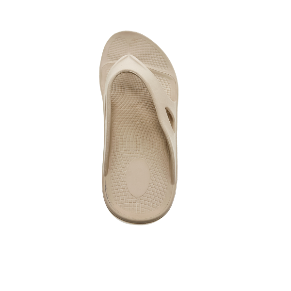 The Sovella Womens PF Thong Beige by SOVELLA is shown from above on a white background, featuring a textured footbed, classic thong design, and built-in arch support for comfort.