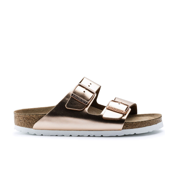 The BIRKENSTOCK Womens Arizona Soft Footbed Leather Sandal in White Copper features two adjustable buckles, a soft cork footbed, and a white sole, shown in profile on a white background.