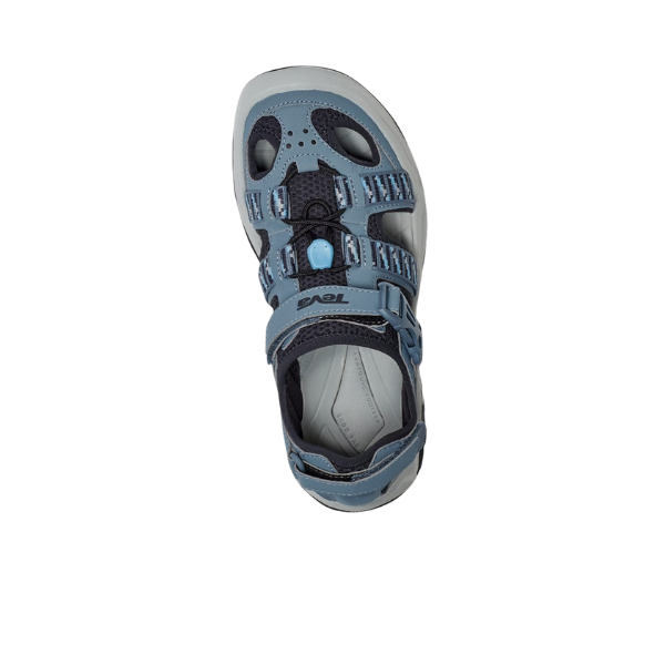 The Teva Women’s Omnium 2 Hybrid Blue Mirage, a blue and gray shoe with mesh panels, cut-out sides, and adjustable recycled plastic straps, is displayed from a top-down view against a white background.