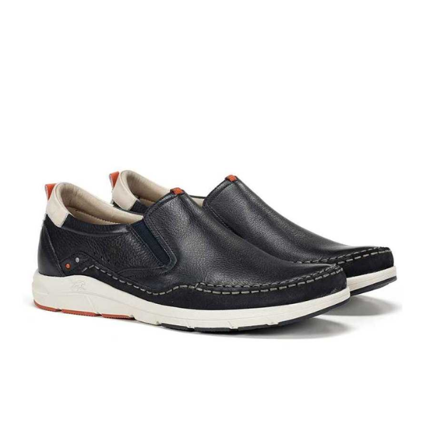 A pair of FLUCHOS Mens Kai Slip-On F1985 shoes in ocean blue, featuring white soles, beige lining, orange heel tab and sole accents, and visible edge stitching. Designed for foot pain relief and exceptional comfort.