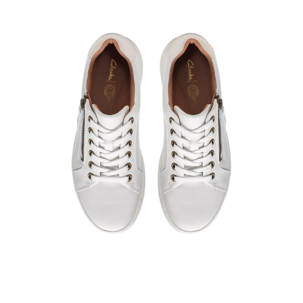 The CLARKS Womens Nalle Lace White sneakers feature white leather, brown insoles, a Contour Cushion footbed for pain relief, gold eyelets, and a zip-up design, shown from above on a plain white background.