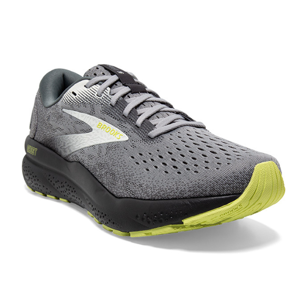 The BROOKS Mens Ghost 16 Grey/Green running shoe features soft cushioning, a silver logo, black sole, and light yellow accents on the tread and branding, shown from a front-side angle.