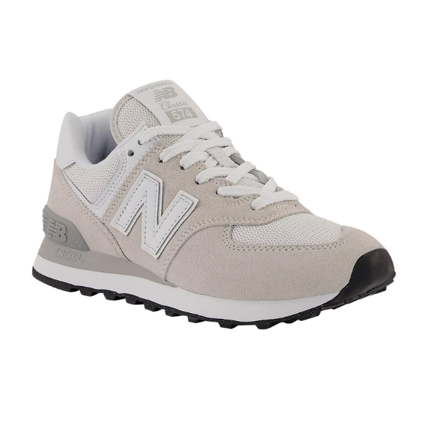 The New Balance Womens 574 Core in White/Grey features a suede and mesh upper, white laces, black rubber sole, and is shown from a side angle on a white background.