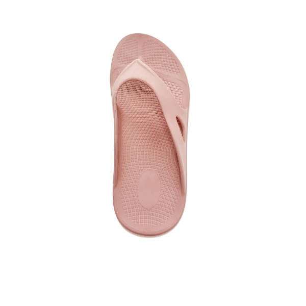 The Sovella Womens PF Thong Pink by Sovella is a single light pink rubber flip-flop shown from above on a white background, featuring a recovery sandal design with arch support, textured footbed, and Wide straps.