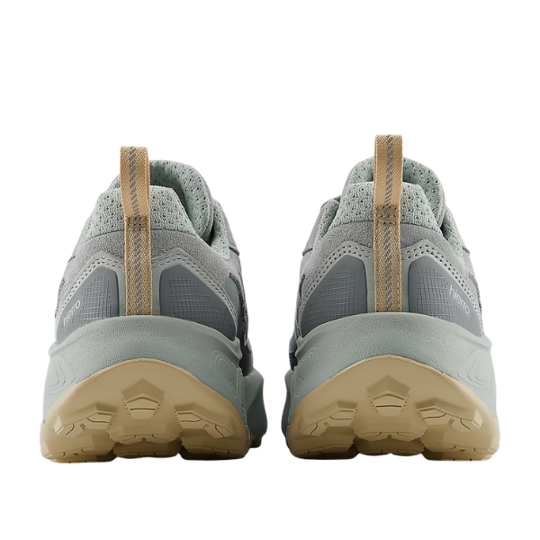 Pair of gray sneakers with beige soles on a white background