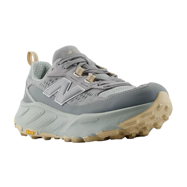 Gray hiking shoe with tan sole on a white background