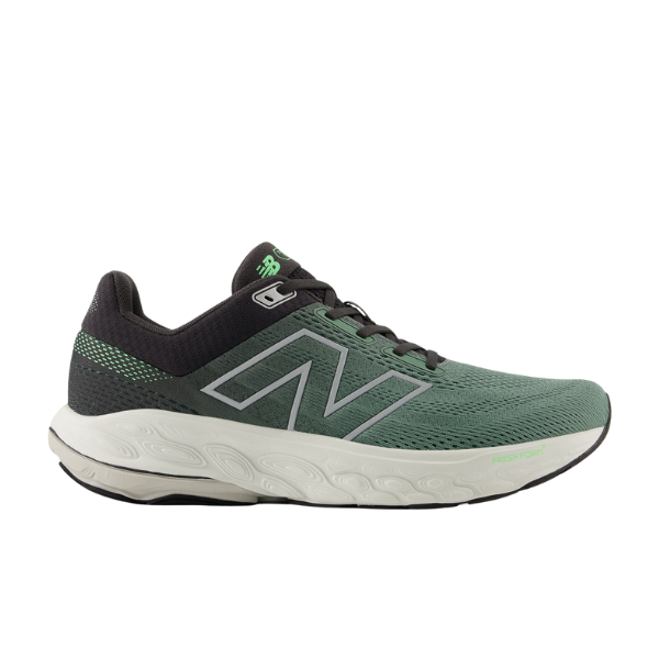 The New Balance Mens Fresh Foam 860v14 Wide in green/grey features a mesh upper, white sole, large N logo, black laces, and light green accents. Fresh Foam X cushioning offers comfort and support. Brand: NEW BALANCE.