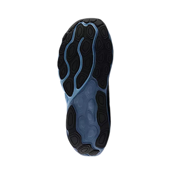 The image shows the sole of the New Balance Mens Fresh Foam 860v14 Wide Grey/Blue sneaker, featuring a black and light blue wavy pattern with oval-shaped rubber grips for support. The background is white.