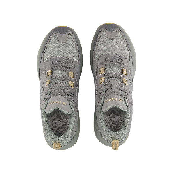Pair of gray sneakers with gold accents on a white background