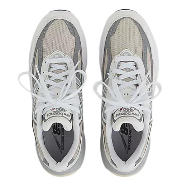 White and gray sneakers with New Balance branding on a white background