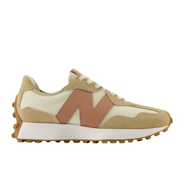 The New Balance Womens 327 Brown/White sneaker by NEW BALANCE features beige and cream tones with a bold pink N logo, gum sole, and white midsole—perfect for adding retro style to any casual outfit.