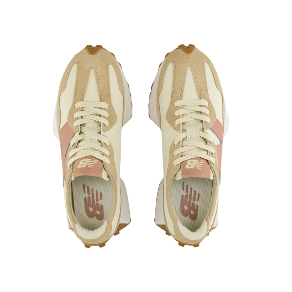 A top-down view of New Balance Womens 327 Brown/White sneakers by NEW BALANCE, featuring beige and cream tones with light tan laces and pink accents, displayed side by side on a white background.