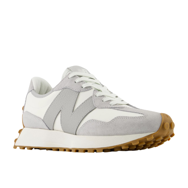 The New Balance Womens 327 Grey/White features a thick gum rubber sole, textured tread, large side logo, and lace-up closure—ideal for women seeking stylish running shoes with comfort and foot pain relief.