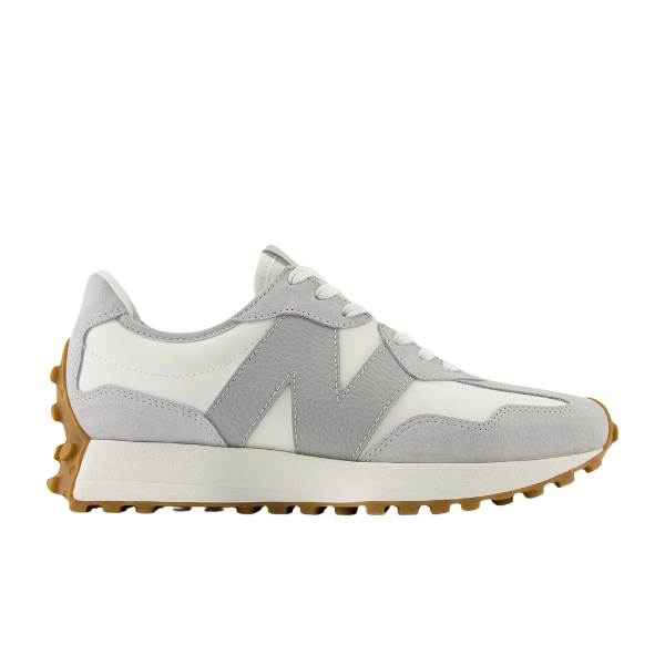 The New Balance Womens 327 Grey/White sneaker features white and light gray suede and leather uppers, a prominent N logo on the side, and a chunky brown rubber sole for grip.
