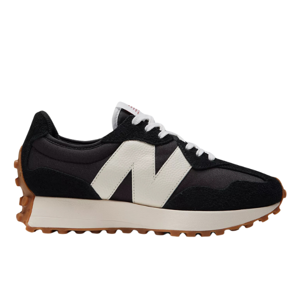 The New Balance Womens 327 Black/White sneaker features a black upper, large white N logo, white laces, and a brown rubber outsole—offering comfort, style, and grip for women seeking athletic shoes designed for foot pain relief.