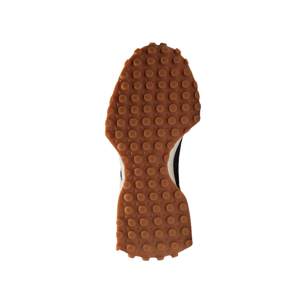 Textured brown rubber sole with circular stud pattern from the bottom, shown on a white background—ideal for womens running shoes like the NEW BALANCE 327 Black/White, combining style and foot pain relief.