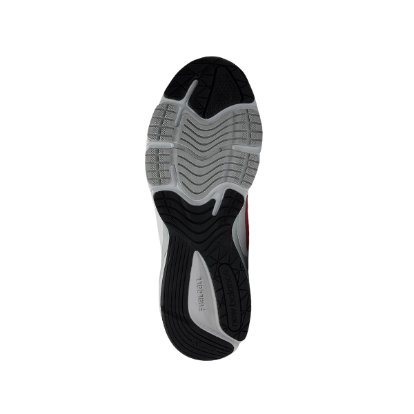 The image shows the sole of the New Balance Womens 990v6 Rose running shoe, featuring black and gray rubber tread for traction and flexibility, plus Trail and Tech text highlighting its advanced FuelCell midsole cushioning.