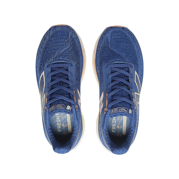 A top view of New Balance Womens Fresh Foam X 1080v14 Blue running shoes shows blue uppers, white soles and laces, silver and gold accents, and insoles labeled for comfort and foot pain relief, all on a white background.