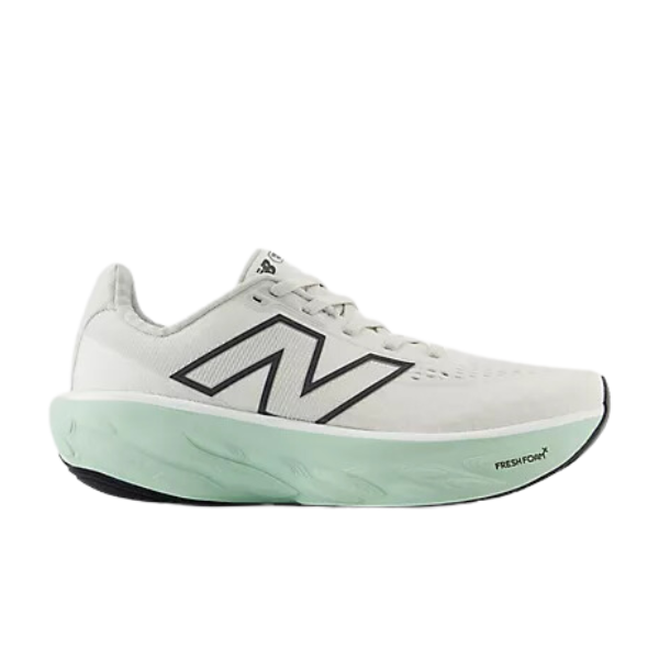 The New Balance Womens Fresh Foam X 1080v14 Wide White/Green features a low-cut design, white upper with a bold black N logo, and a thick light green Fresh Foam X cushioned sole. Shown in side profile view.