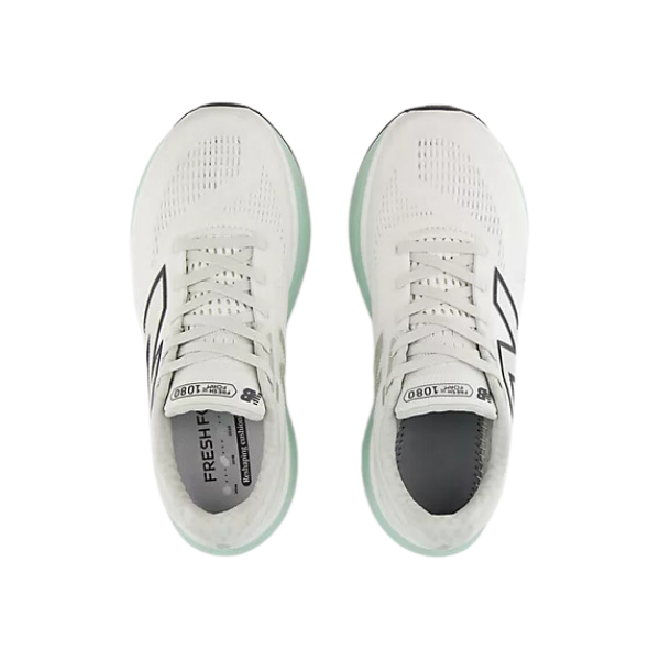 A pair of New Balance Womens Fresh Foam X 1080v14 Wide running shoes in white with light green soles, mesh uppers, large black N logos, and Fresh Foam X 1080 labeling on the tongue, viewed from above.