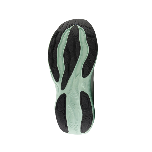 The image displays the sole of the New Balance Womens Fresh Foam X 1080v14 Wide White/Green running shoe, featuring a wavy black and mint green design with Fresh Foam X technology, shown from below on a white background.