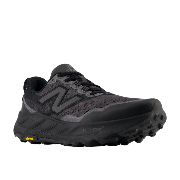 The New Balance Womens Fresh Foam X Hierro v9 Wide Black trail runner features a black and gray design, large N logo, rugged Vibram® outsole, and Fresh Foam branding on the midsole, shown against a white background.
