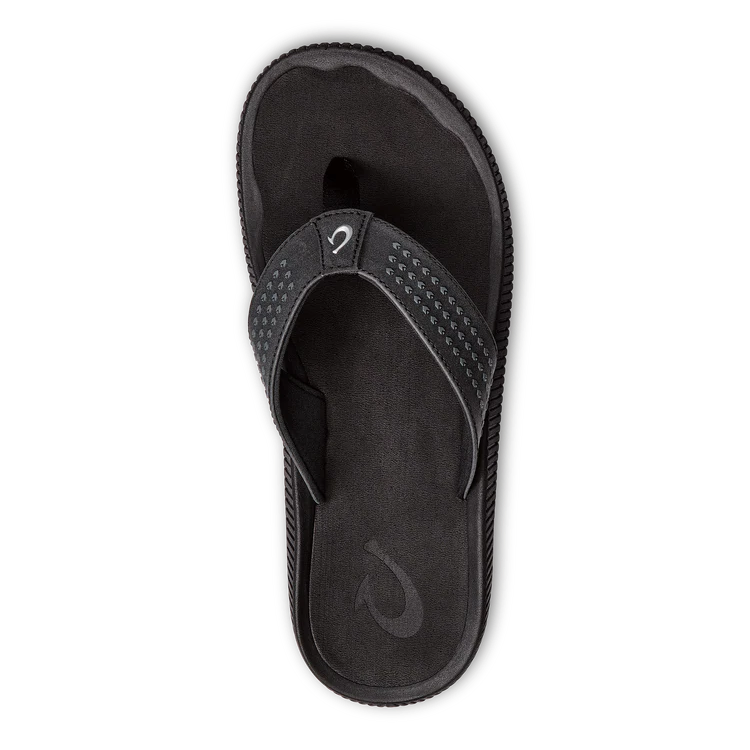 The OLUKAI Mens Ulele Black sandal is water-resistant with a textured footbed and perforated strap, plus subtle logos on the strap and sole, designed for comfort and support.