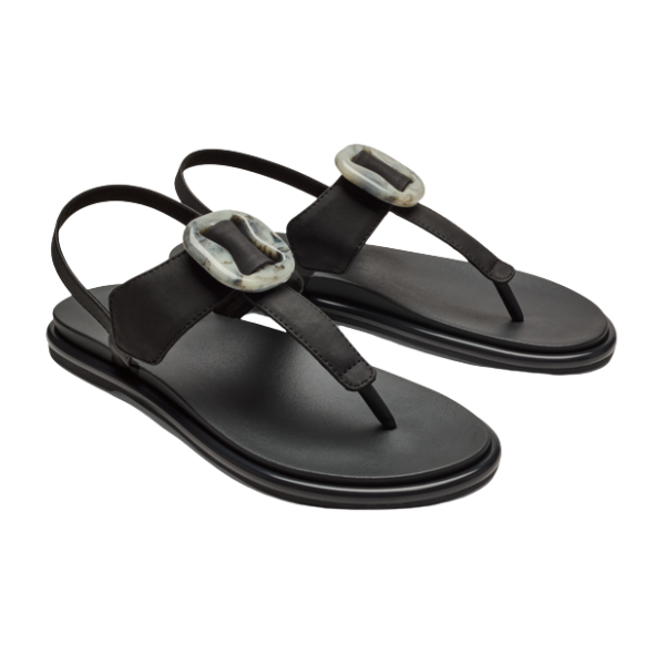 The OLUKAI Womens La‘i T–Bar Lava Rock sandals feature flat soles, a comfy T-Bar design, slingback straps, and large marbled buckles—ideal stylish footwear for plantar fasciitis support.