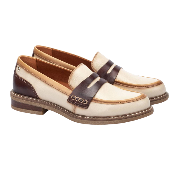The Pikolino Womens Aldaya Cream loafers by PIKOLINOS feature cream calfskin leather with brown accents, a penny strap, and tan soles with visible stitching for added comfort.