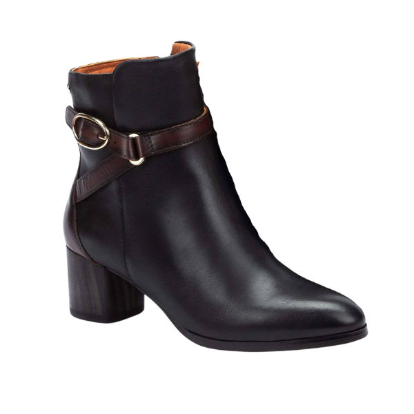 The PIKOLINOS Women’s Calafat Black ankle boot features black leather, a block heel, brown leather strap, and decorative metal buckle for comfort and everyday style.