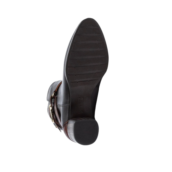 The image shows the sole of the PIKOLINOS Womens Calafat Black dress shoe, featuring a low heel, slip-resistant pattern for extra comfort, brown upper detailing, and a decorative side buckle.