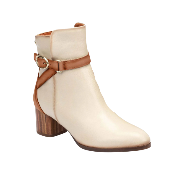 The Pikolinos Women’s Calafat Cream ankle boots by PIKOLINOS feature a medium block heel, pointed toe, and brown leather strap with metal buckle, crafted from supple calfskin for comfort. Shown on a white background.