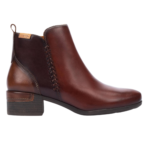 The PIKOLINOS Womens Malaga Cognac is a brown calfskin leather ankle boot with a low block heel, side stitching, and back pull tab—ideal for comfort seekers. Displayed on a white background.
