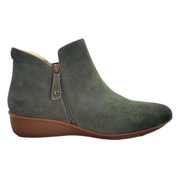 A side view of the Revere Womens Damascus Bootie Wide Moss by REVERE, featuring green suede, a brown wedge sole, comfort footbed, and a side zipper.