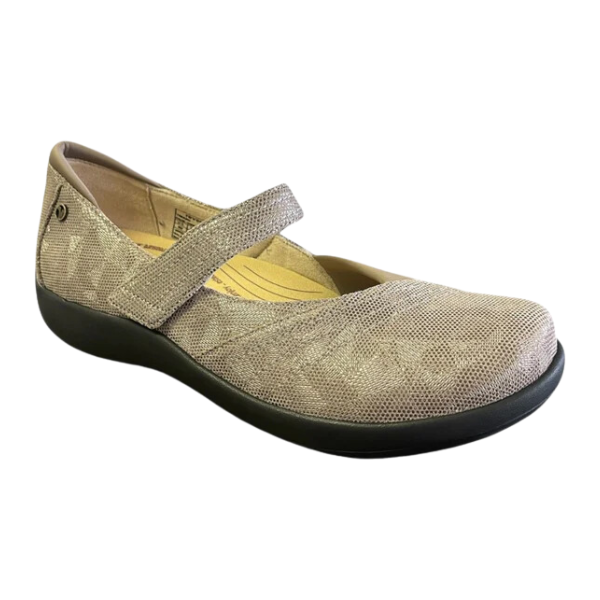 The Revere Womens Timaru Mary Jane Champagne by REVERE features a beige textured finish, single Velcro strap, black sole, and cushioned insole for all-day comfort.
