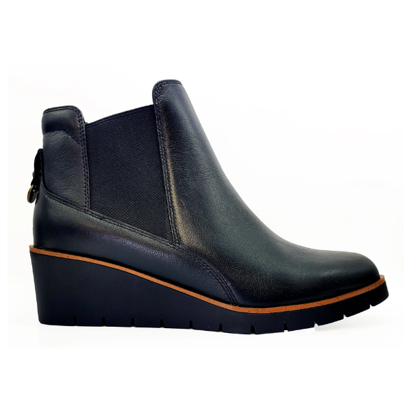 The REVERE Reverse Womens Galway Wedge Bootie Wide in black features a premium leather upper, elastic side panels, and a wedge heel, shown on a white background.