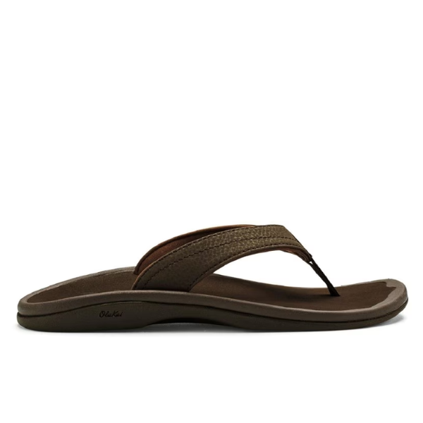 The OluKai Womens Ohana Dark Java sandal features a textured strap and anatomical footbed, displayed in side profile against a white background.