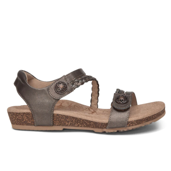 Aetrex Womens Jillian Bronze: A brown open-toe sandal with a low cork wedge heel, braided ankle strap, round metal accents, and a cushioned Lynco orthotic footbed for contoured comfort.