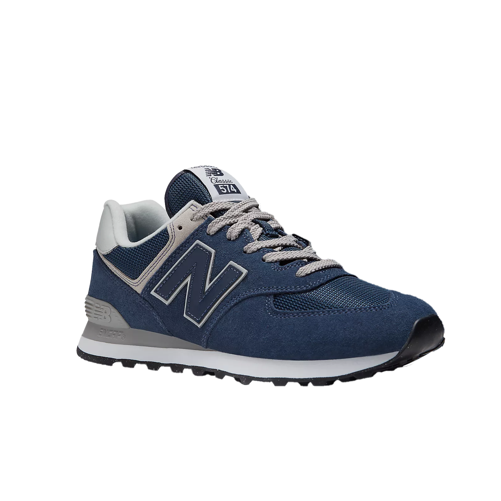 The New Balance Mens 574 Navy sneaker features navy mesh and suede with gray accents, a white sole, and is designed by NEW BALANCE to help reduce foot pain. Displayed on a white background.