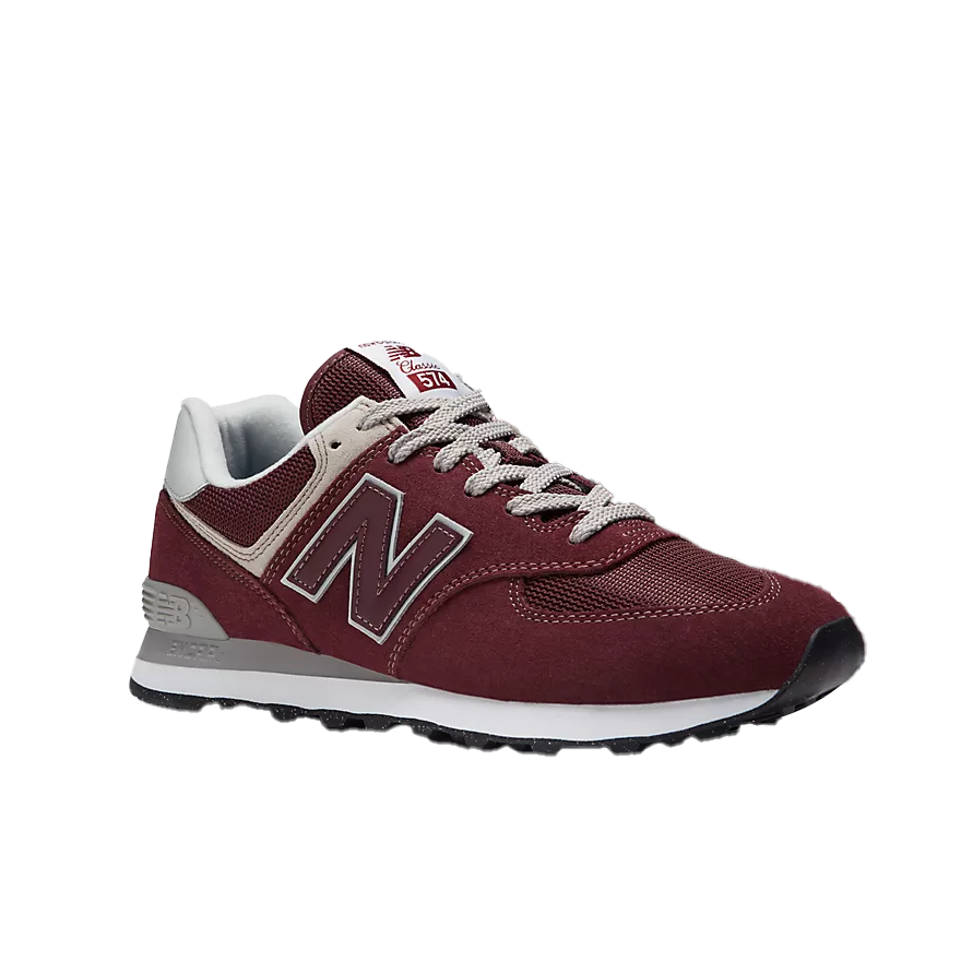 The NEW BALANCE Mens 574 Magenta features a maroon upper with white and gray accents, white laces, a white midsole, black outsole, and the iconic “N” logo—classic running shoes designed for foot comfort.